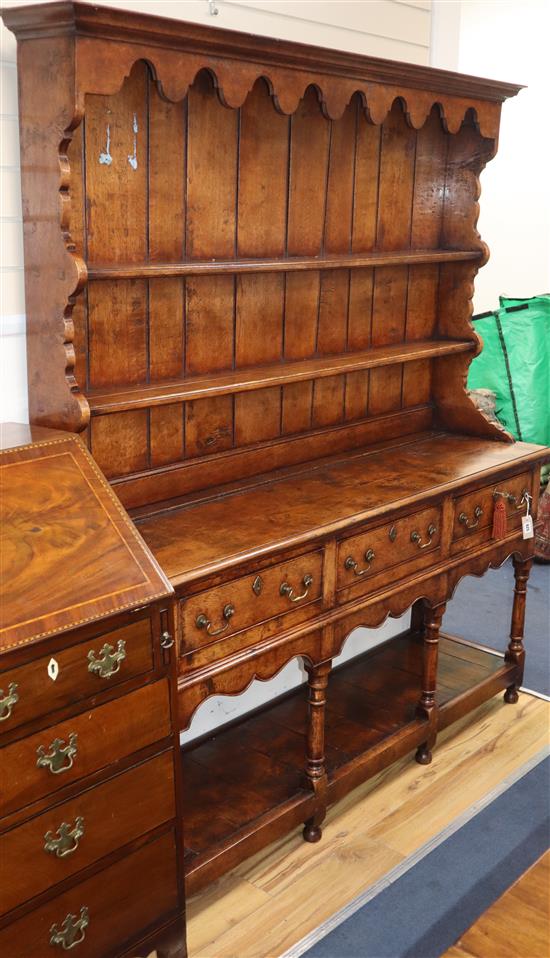 A mid 18th century style elm dresser W.162cm